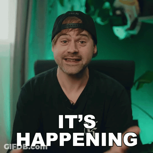 A Man Wearing A Hat And A Black Shirt Says It 'S Happening GIF