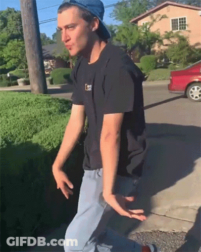 A Man Wearing A Hat And A Black Shirt With The Letter L On The Front GIF
