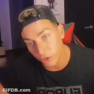 A Man Wearing A Hat And A Black Shirt With The Word Rogue On It GIF