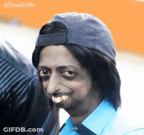 A Man Wearing A Hat And A Blue Shirt Is Smiling And Says Me Too GIF