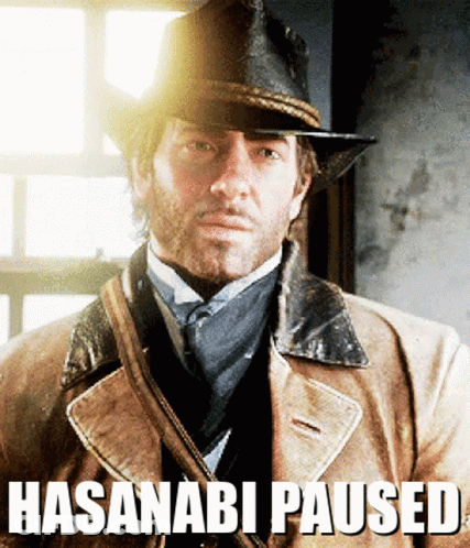 A Man Wearing A Hat And A Coat With The Words Hasanabi Paused Written Below Him GIF