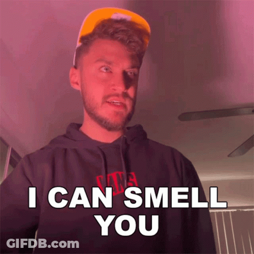 A Man Wearing A Hat And A Hoodie Says " I Can Smell You " GIF