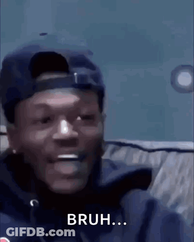 A Man Wearing A Hat And A Jacket Is Smiling And Says Bruh . GIF