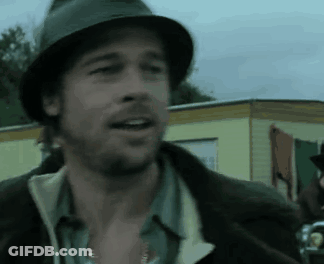 A Man Wearing A Hat And A Jacket Is Talking GIF