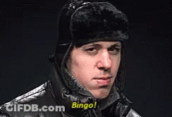 A Man Wearing A Hat And A Jacket Says Bingo ! GIF