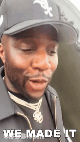 A Man Wearing A Hat And A Jacket Says We Made It GIF