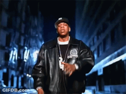 A Man Wearing A Hat And A Jacket With The Number 3 On The Front GIF