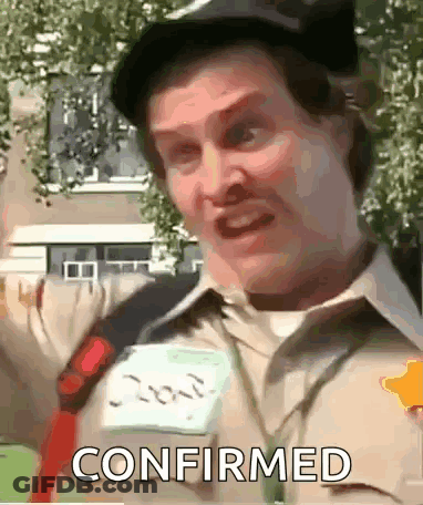 A Man Wearing A Hat And A Name Tag That Says Confirmed On It . GIF
