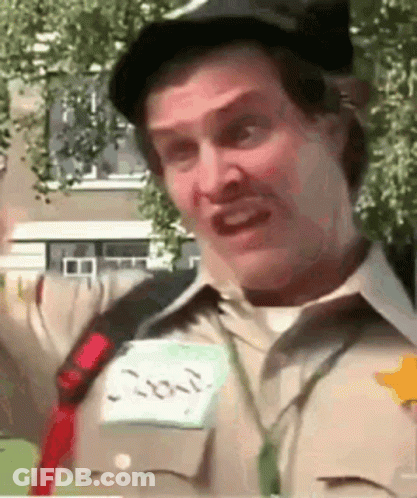 A Man Wearing A Hat And A Name Tag That Says ' Joker ' On It GIF