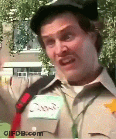 A Man Wearing A Hat And A Name Tag That Says Ron GIF