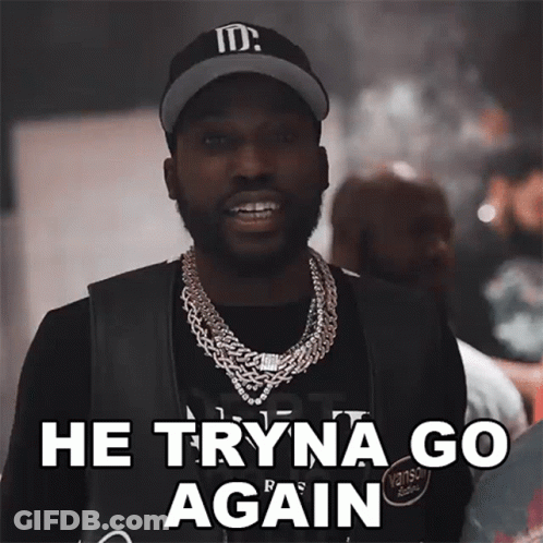A Man Wearing A Hat And A Necklace Says " He Tryna Go Again " GIF