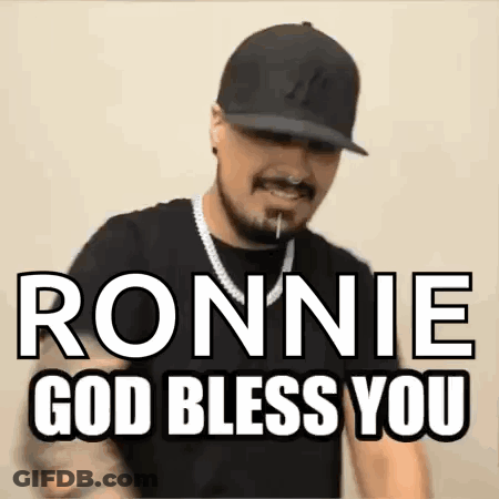 A Man Wearing A Hat And A Necklace Says Ronnie God Bless You . GIF