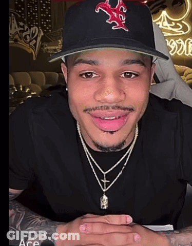 Man Wearing Hat And Cross Necklace GIF