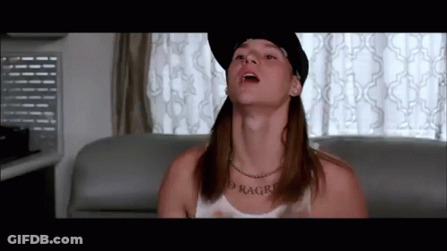 A Man Wearing A Hat And A Necklace With The Word Ragro On His Neck GIF