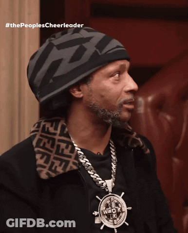 A Man Wearing A Hat And A Necklace With The Words #Thepeoplescheerleader GIF