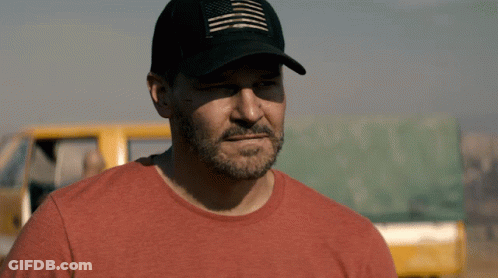 A Man Wearing A Hat And A Red Shirt GIF