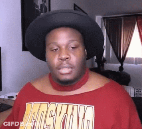 A Man Wearing A Hat And A Red Shirt That Says Jansvina On It GIF
