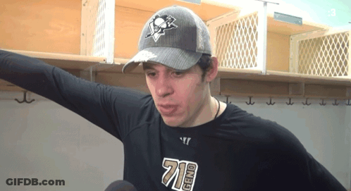 A Man Wearing A Hat And A Shirt That Says ' 710 ' On It GIF