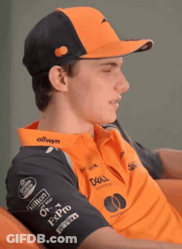 A Man Wearing A Hat And A Shirt That Says Allwyn On It GIF