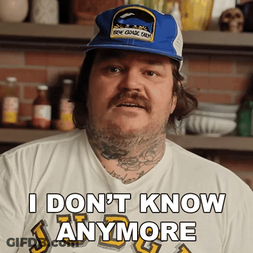 A Man Wearing A Hat And A Shirt That Says I Don T Know Anymore GIF
