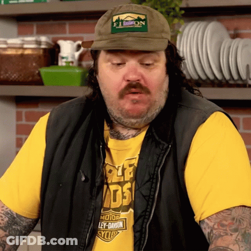 A Man Wearing A Hat And A Shirt That Says Ley-Davidson GIF