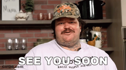 A Man Wearing A Hat And A Shirt That Says " See You Soon " GIF