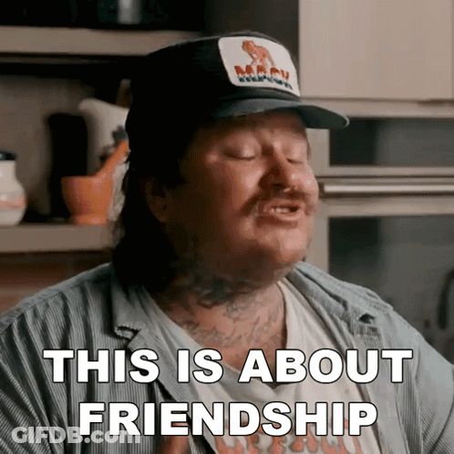 A Man Wearing A Hat And A Shirt That Says This Is About Friendship GIF