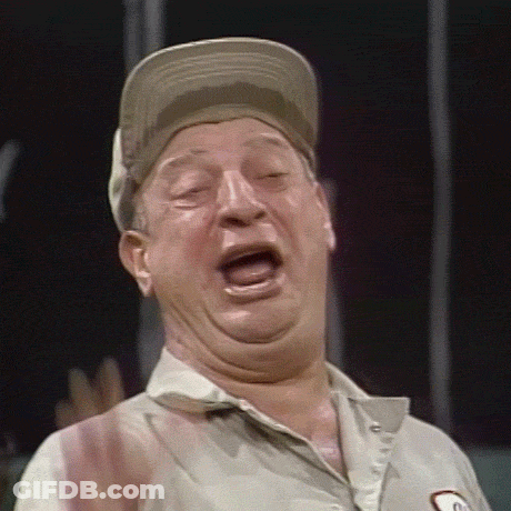 A Man Wearing A Hat And A Shirt With The Letter G On It GIF