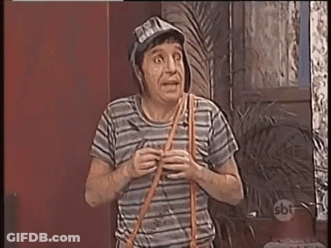 A Man Wearing A Hat And A Striped Shirt Is Holding A Rope In His Hand . GIF