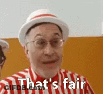 A Man Wearing A Hat And A Striped Shirt Is Saying That 'S Fair . GIF