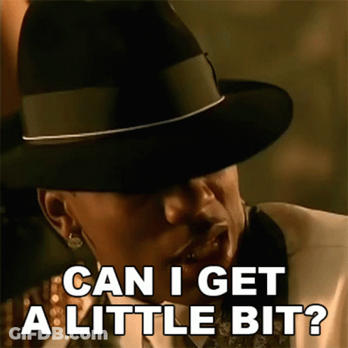 A Man Wearing A Hat And A Suit Is Asking Can I Get A Little Bit . GIF