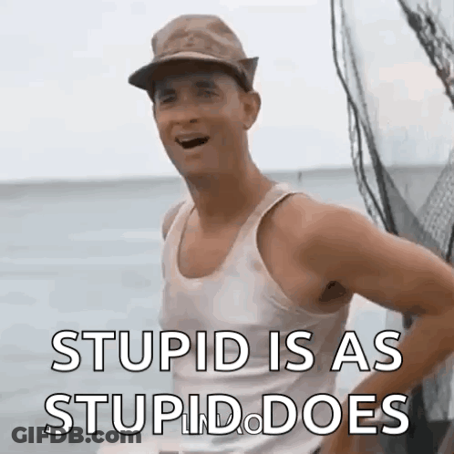 A Man Wearing A Hat And A Tank Top Is Standing On A Boat In The Ocean . GIF