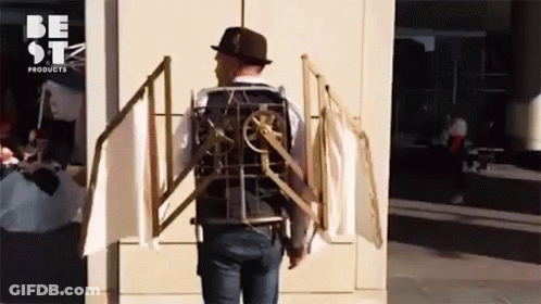 A Man Wearing A Hat And A Vest That Says Be Stz Products GIF