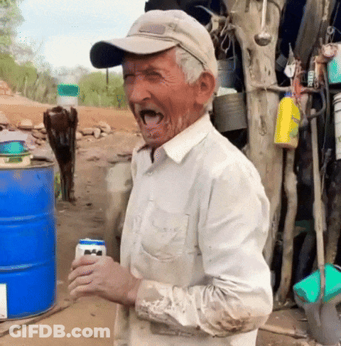 A Man Wearing A Hat And A White Shirt Is Holding A Can Of Beer GIF