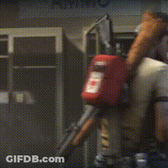 A Man Wearing A Hat And A White Shirt Looks Over His Shoulder GIF