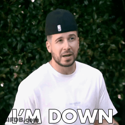 A Man Wearing A Hat And A White Shirt Says I 'M Down . GIF