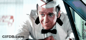 A Man Wearing A Hat And Bow Tie Is Looking Out Of A Car Window With The Words Craveler2023 On The Bottom GIF
