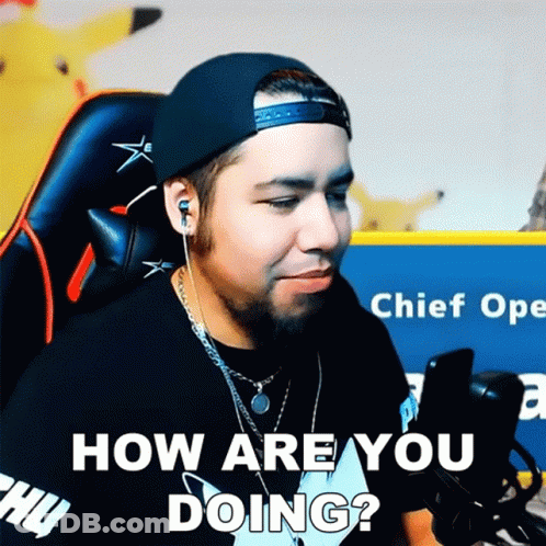 A Man Wearing A Hat And Ear Buds Is Asking How Are You Doing GIF