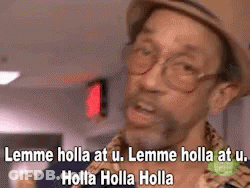 A Man Wearing A Hat And Glasses Is Making A Funny Face And Saying Lemme Holla At U. GIF