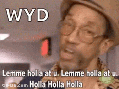 A Man Wearing A Hat And Glasses Is Making A Funny Face While Talking . GIF