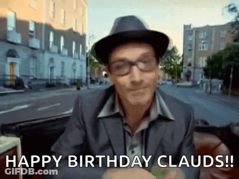 A Man Wearing A Hat And Glasses Is Saying Happy Birthday Clauds ! GIF