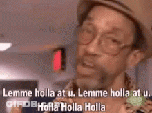 A Man Wearing A Hat And Glasses Is Saying Lemme Holla At U. GIF