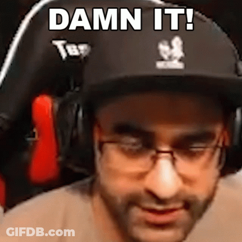 A Man Wearing A Hat And Glasses Is Sitting In A Chair And Says `` Damn It ! '' GIF