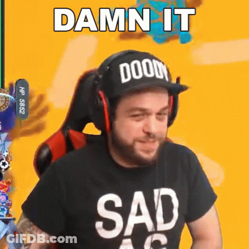 A Man Wearing A Hat And Headphones Is Sitting In A Chair And Making A Sad Face . GIF