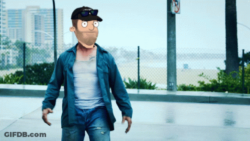 A Man Wearing A Hat And Sunglasses Is Walking Down A Street GIF