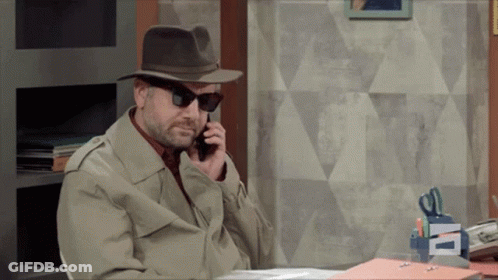A Man Wearing A Hat And Sunglasses Talking On A Cell Phone GIF