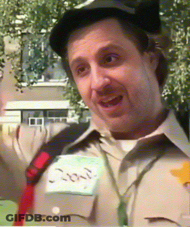 A Man Wearing A Hat And Tie Has A Name Tag That Says Jon GIF