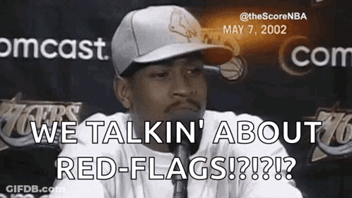 A Man Wearing A Hat And Tie Is Talking About Red-Flags GIF