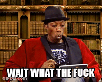 A Man Wearing A Hat Is Holding A Tablet With The Words Wait What The Fuck Below Him GIF