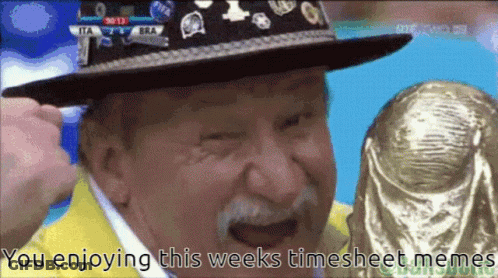 A Man Wearing A Hat Is Holding A Trophy With The Words You Enjoying This Weeks Timesheet Memes Below Him GIF
